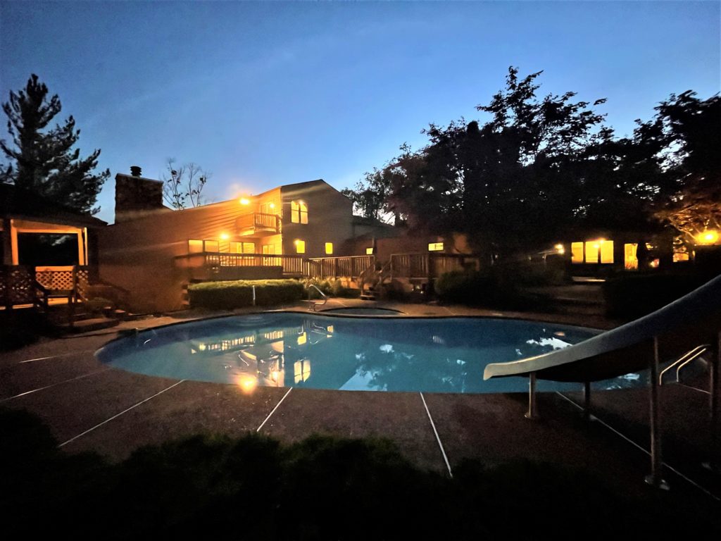 Twilight Rear Elevation View: Gazebo, Main House, Guest House, and Heated Pool/Spa/Slide