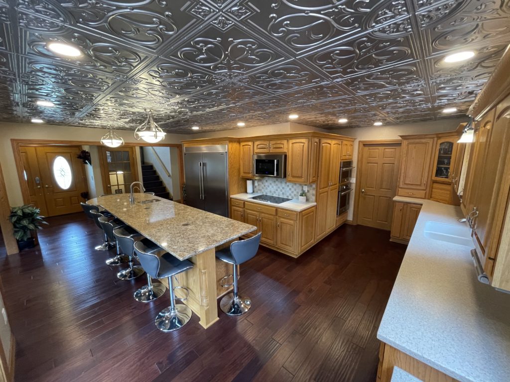 Faux tin ceiling! 3 Ovens (2 Microwave/Convection Oven Combination Units & 1 Full Size Convection/Etc); Induction Cooktop (also plumbed for gas)